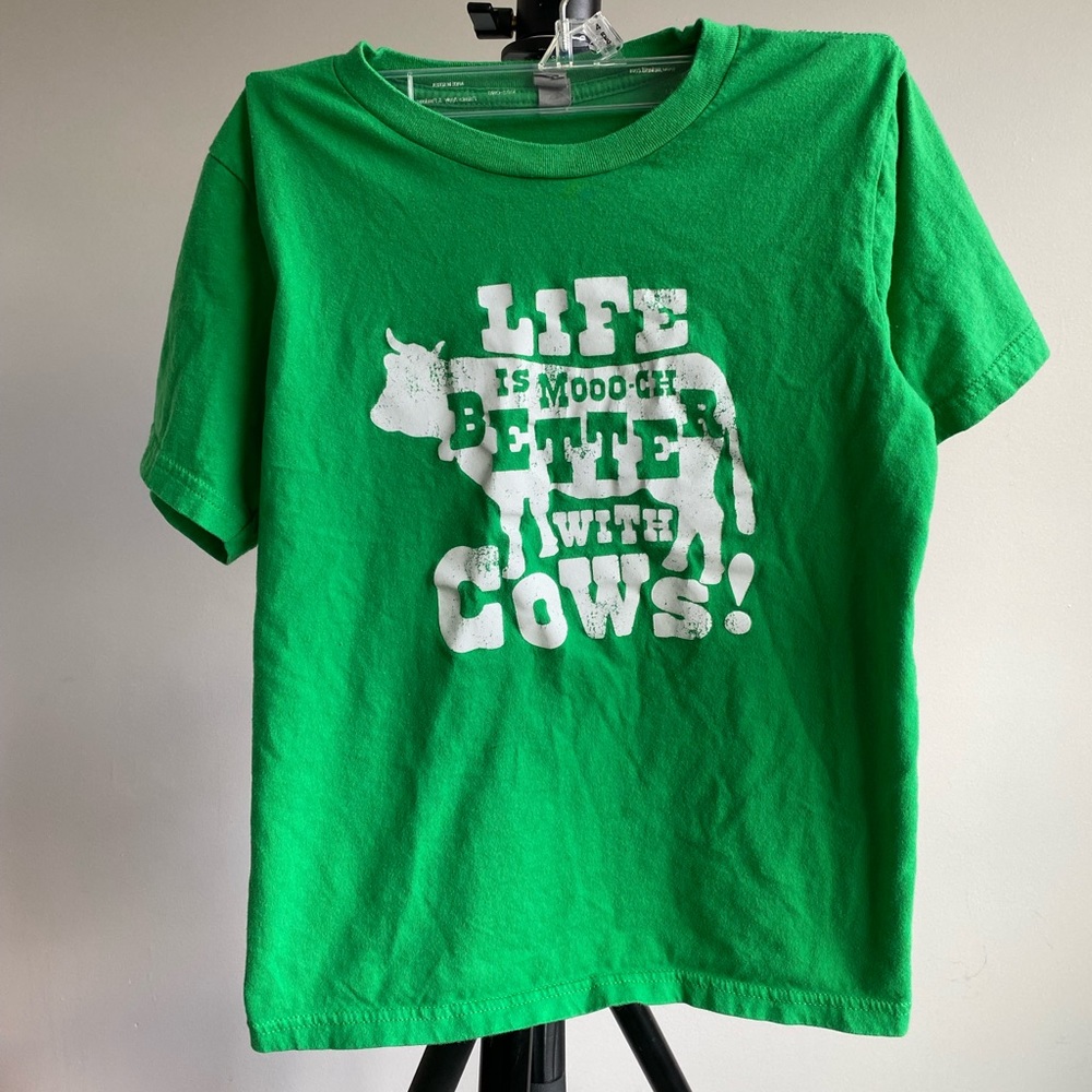 Green t-shirt with cow graphic